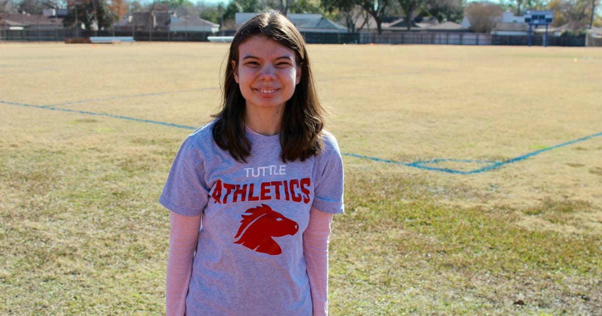 Tuttle high school student smiles while outside.