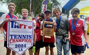 Six students stand while holding a banner that reads "TAPPS Tennis Champions"